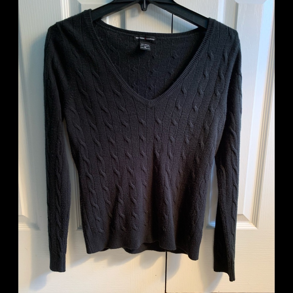 Black V neck sweater.